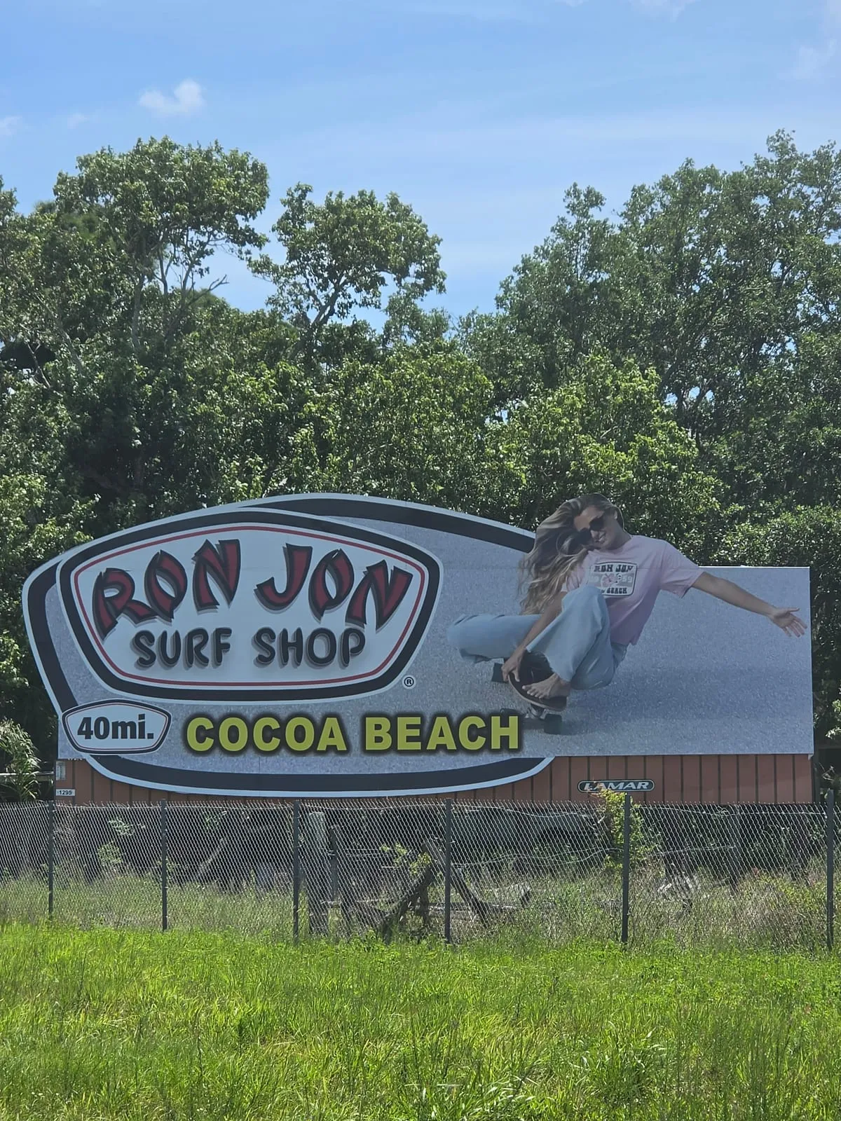 Lucy Spotts on a Ron Jon Surf Shop billboard in Cocoa Beach.